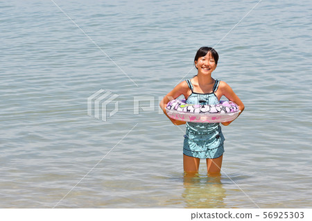 A girl who enjoys swimming A girl who enjoys swimming 56925303