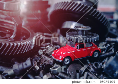 red car on the background of old spare parts 56925305