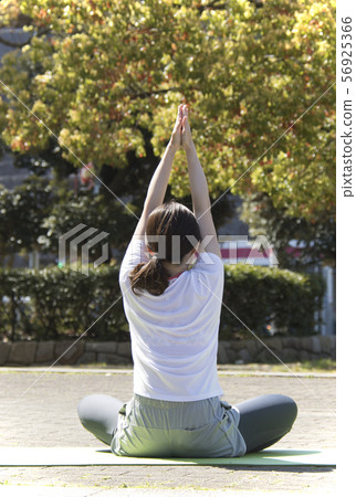 Stretch park woman yoga back view 56925366