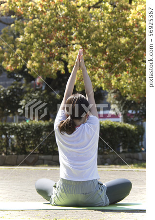 Stretch park woman yoga back view Stretch park woman yoga back view 56925367