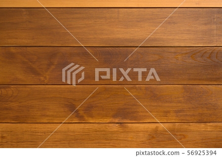 The unique texture of wooden wall made of planks colored with natural brown paint, tiled background 56925394