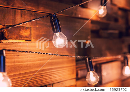 Wooden planks with lamps background. Decorated 56925702