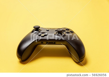 Black joystick on yellow background. Computer Black joystick on yellow background. Computer 56926056