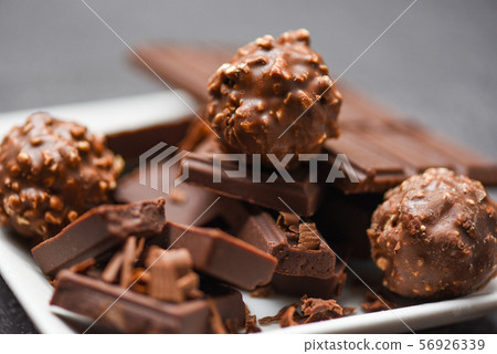 chocolate bar and chocolate ball on white plate on chocolate bar and chocolate ball on white plate on 56926339