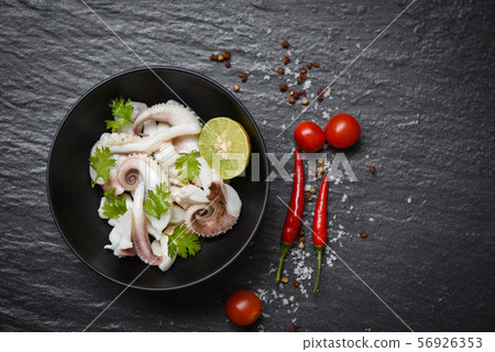 squid salad bowl with lemon herbs and spices on 56926353