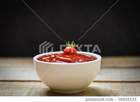 Fresh tomatoes on ketchup in cup tomato sauce on 56926535