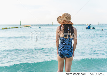 Girl in bikini on a windy beach in thailand 56931252