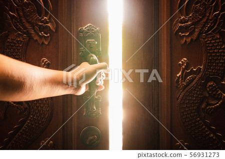 Hand open door light concept 56931273