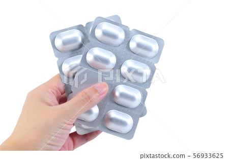 Packs of medicine in hand isolated on white Packs of medicine in hand isolated on white 56933625