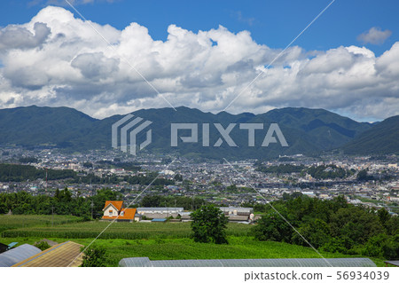 A distant view of Iida city, Nagano prefecture, July 2019 56934039