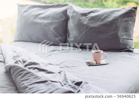 grey bed sunlight sunday. pillow blanket. cup 56940625