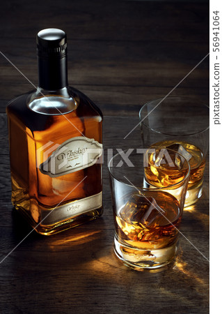 whiskey and two glasses 56941064