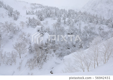 Tokachidake mountain range snow scene seen from Tokachidake Onsen Tokachidake mountain range snow scene seen from Tokachidake Onsen 56942431