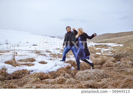 Couple in the winter landscape Couple in the winter landscape 56944513
