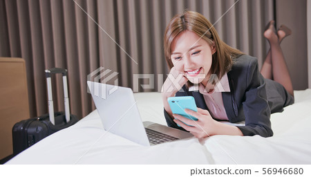 woman handle buisness on trip 56946680