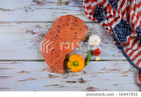 Raw beef steak with spice and flag of United Raw beef steak with spice and flag of United 56947858