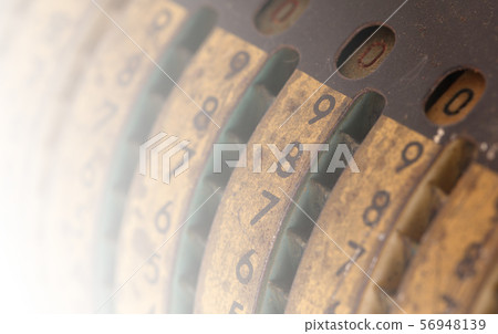 Vintage manual adding machine isolated 56948139