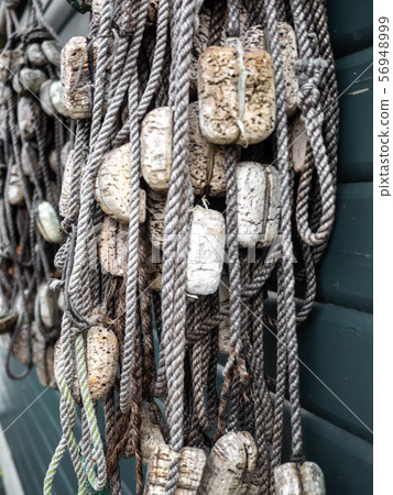 Fishing nets and ropes hang outside on the house 56948999