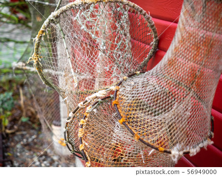 Fishing nets and ropes hang outside on the house Fishing nets and ropes hang outside on the house 56949000