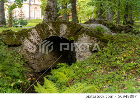 Russia. Lomonosov. Picturesque historical bridge over the ditch in Oranienbaum Lomonosov Park. 56949897