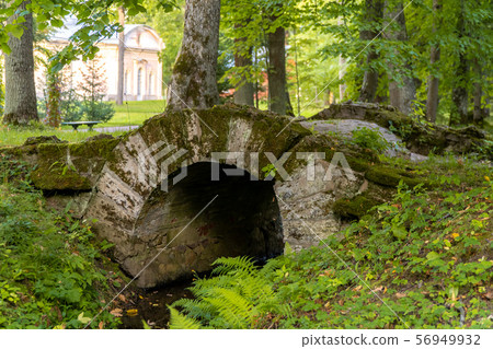 Russia. Lomonosov. Picturesque historical bridge over the ditch in Oranienbaum Lomonosov Park. 56949932