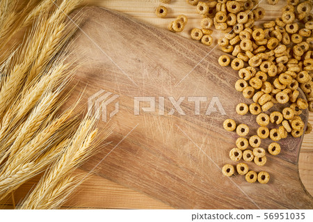 wooden background with yellow ears of rye and breakfast crunchy wooden background with yellow ears of rye and breakfast crunchy 56951035