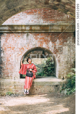 A kimono woman sightseeing in Kyoto 56951999