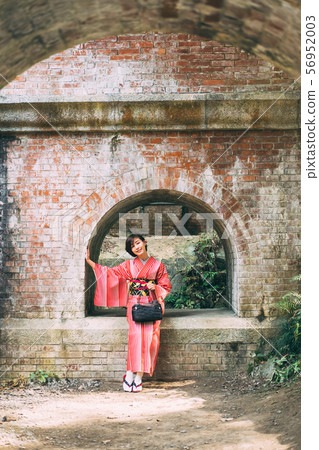 A kimono woman sightseeing in Kyoto A kimono woman sightseeing in Kyoto 56952003