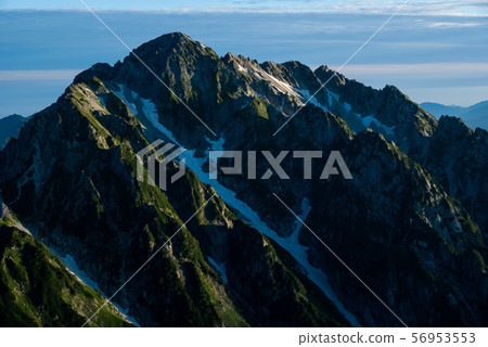 Mt. Minato illuminated by the morning sun in the Northern Alps 56953553