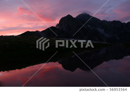 The evening sun reflected on the surface of the Northern Alps 56953564