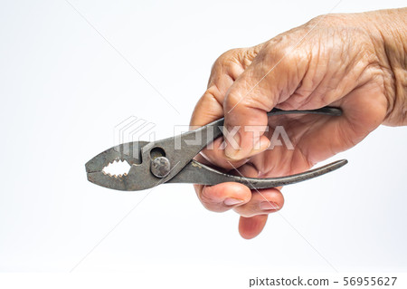 Senior Woman's right hand holding silver metal pliers on white background, Construction building and repair tool concept 56955627