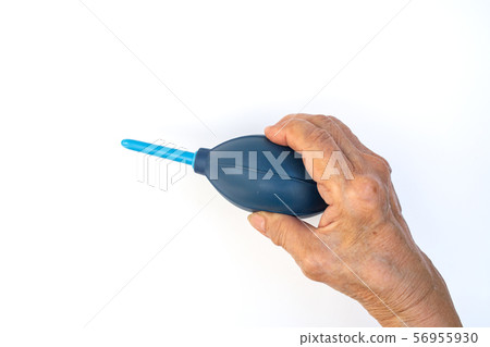 Senior woman's hands squeezing blue blower for cleaning Lens isolated on white background 56955930