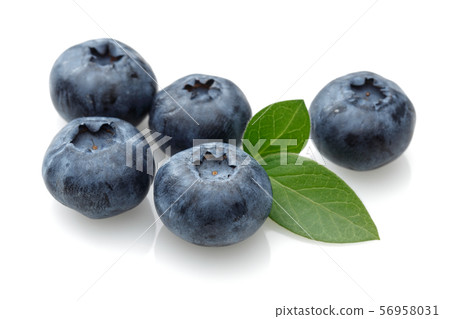Fresh blueberries with leaves isolated on white Fresh blueberries with leaves isolated on white 56958031