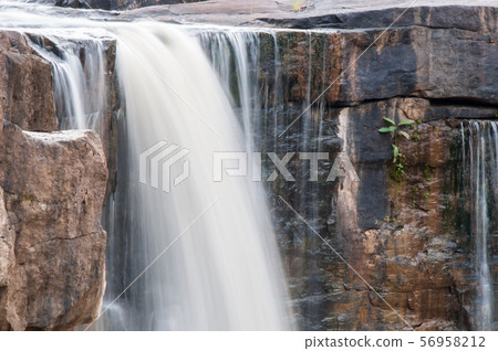 Closeup of the clear waterfall. Closeup of the clear waterfall. 56958212