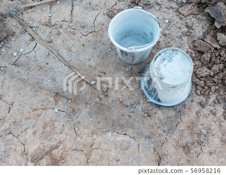 Twin plastic bucket with the cement stain. 56958216