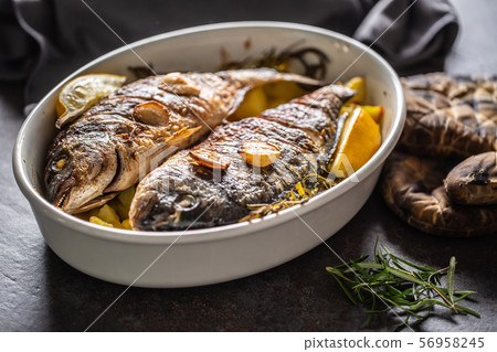 Roasted mediterranean fish bream with potatoes Roasted mediterranean fish bream with potatoes 56958245