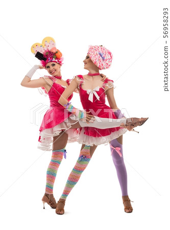 Playful women in original hats and dresses view Playful women in original hats and dresses view 56958293