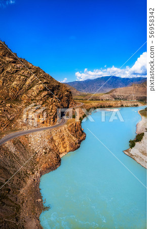 Vertical photo of road in Altai mountains. Vertical photo of road in Altai mountains. 56958342