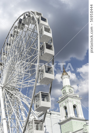 Ferris wheel on a sunny summer day, Kiev, Ukraine Ferris wheel on a sunny summer day, Kiev, Ukraine 56958444
