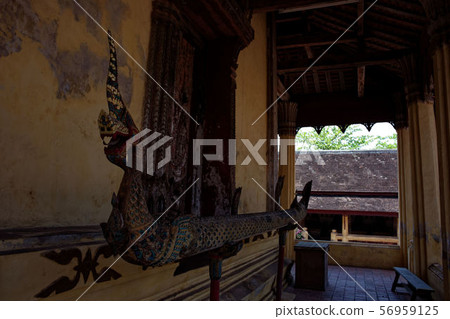 Laos Vientiane: Wat Si Saket dragon, dragon, wooden Laos Vientiane: Wat Si Saket dragon, dragon, wooden 56959125