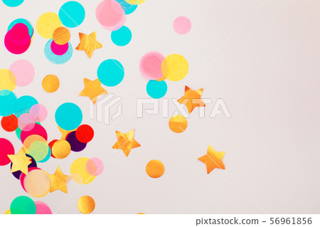 Multicolor confetti on grey background. 56961856