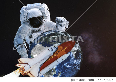 Astronaut in a front of Earth planet 56962007