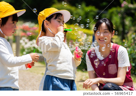 Preschoolers and children playing in the park Preschoolers and children playing in the park 56965417