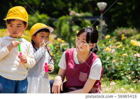 Preschoolers and children playing in the park Preschoolers and children playing in the park 56965418