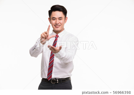 Asian businessman standing and point his finger.. 56966398