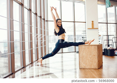 A beautiful girl is engaged in a gym 56968000