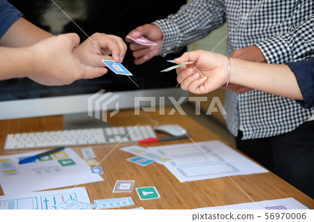 user experience UX designer designing web on smart phone layout. UI developer planning working on mobile application prototype 56970006