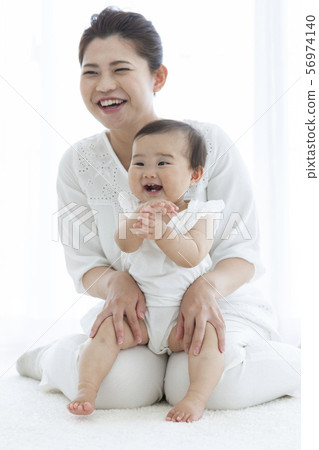 Smiling mother and baby 56974140
