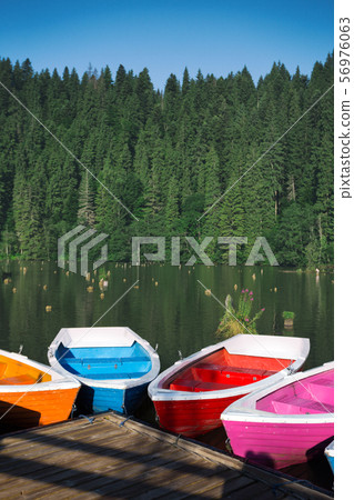 bright boats on a mountain lake 56976063
