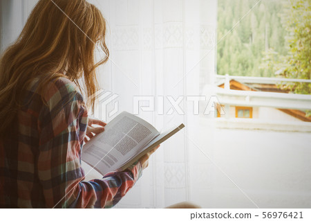 girl on a windowsill girl on a windowsill 56976421